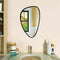 Pebble-shaped LED mirror with organic curves, soft backlighting, and a modern designer finish.